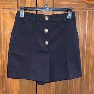Black with gold buttons, high rise shorts!